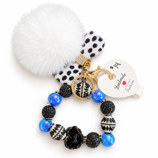 Black and blue sparkle beaded wristlet keychain bracelet with white pom pom
