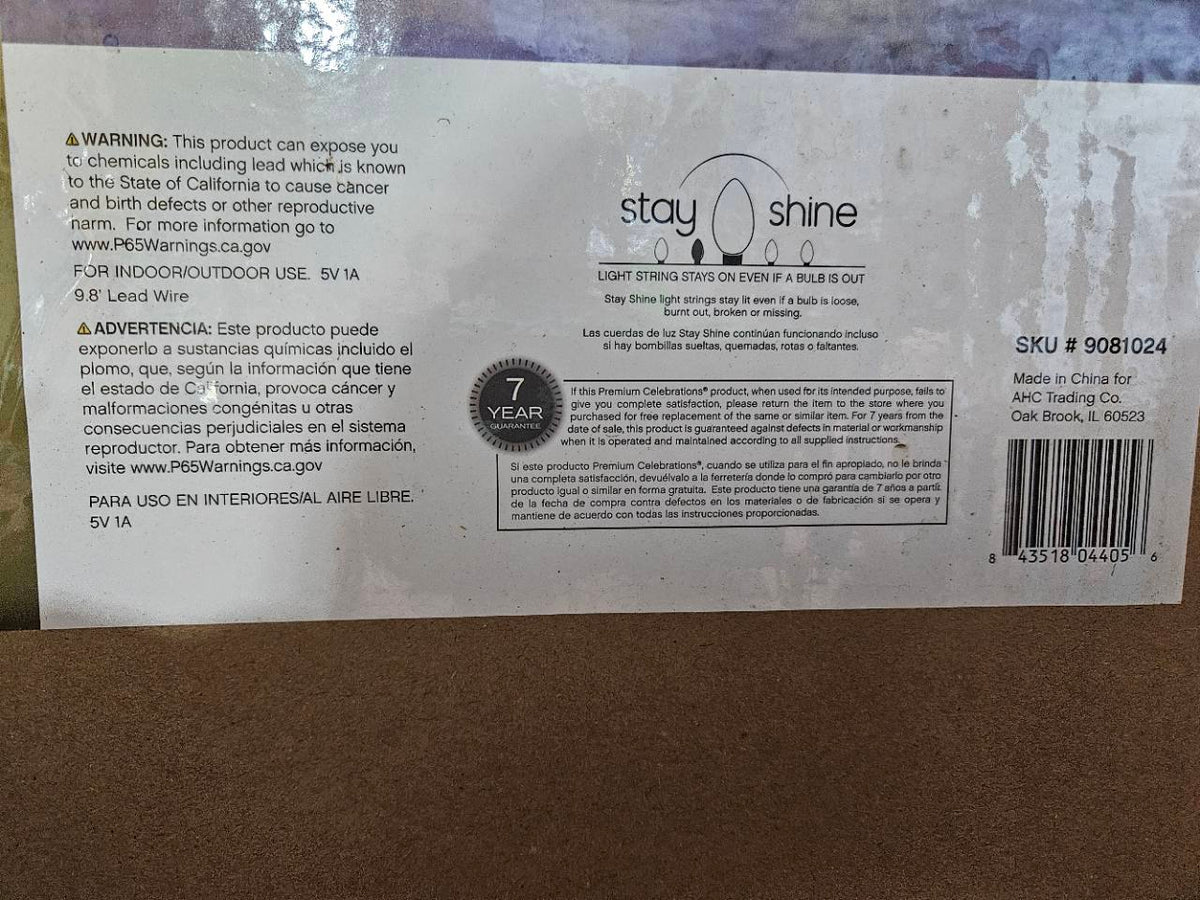 Actual safety label for Celebrations RGB spiral tree showing lead warning, Ace item 9081024, and UPC 843518044056.