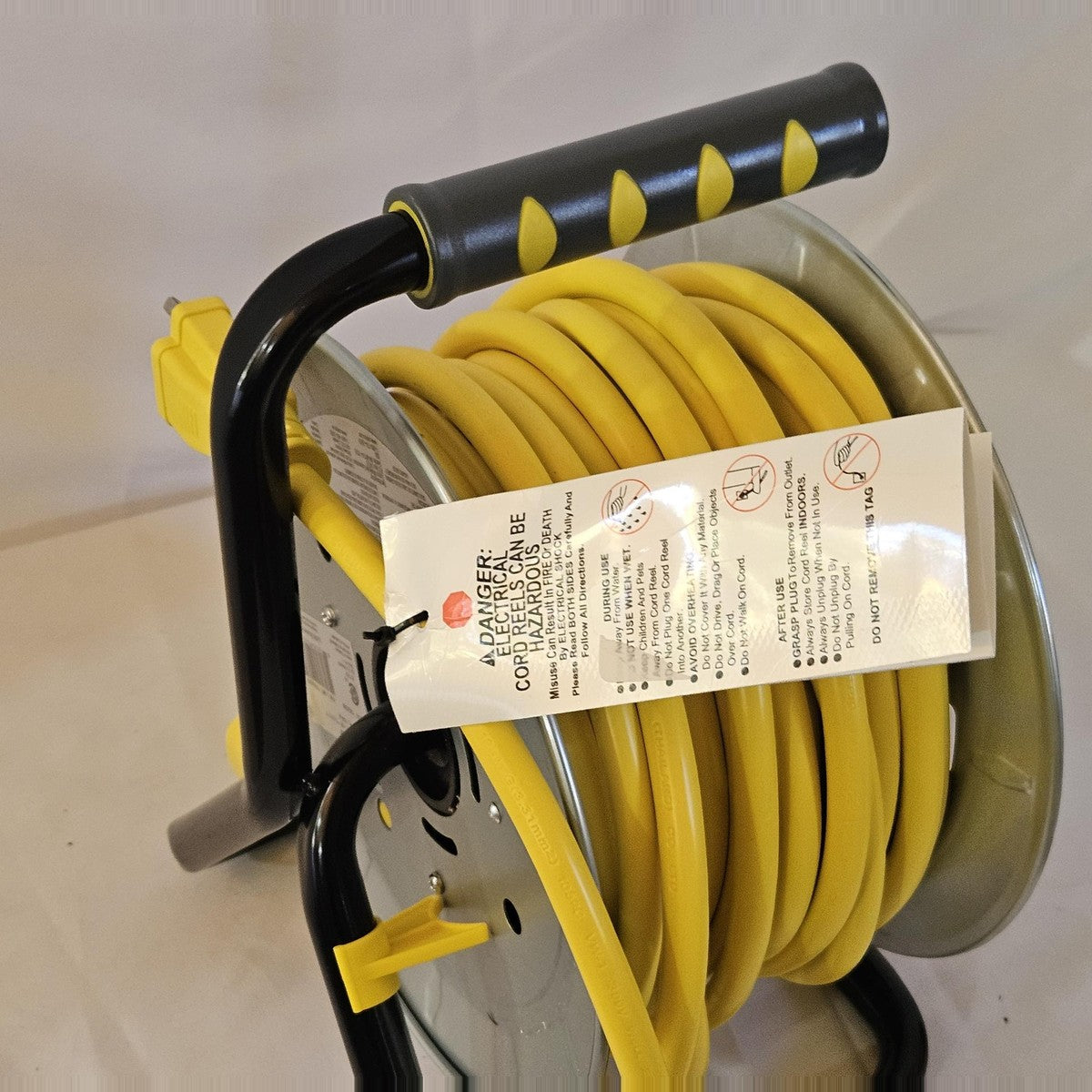 Link2Home 50 ft cord reel side view with yellow 12 AWG cord and handle